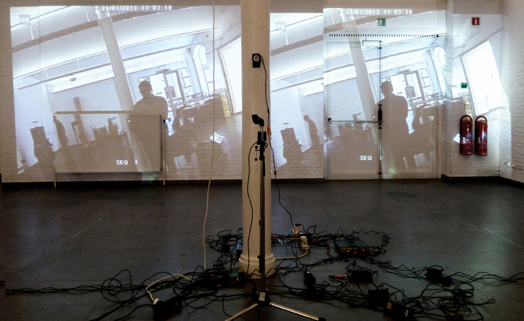 A surveillance system that incorporates the visitors to the gallery inside the artwort, as a performative spectacle of surveillance. 2008. Stanza