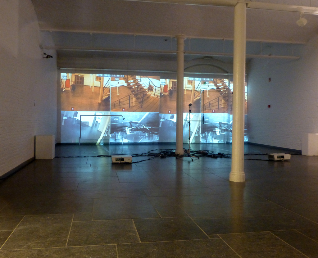 A surveillance system that incorporates the visitors to the gallery inside the artwort, as a performative spectacle of surveillance. 2008. 